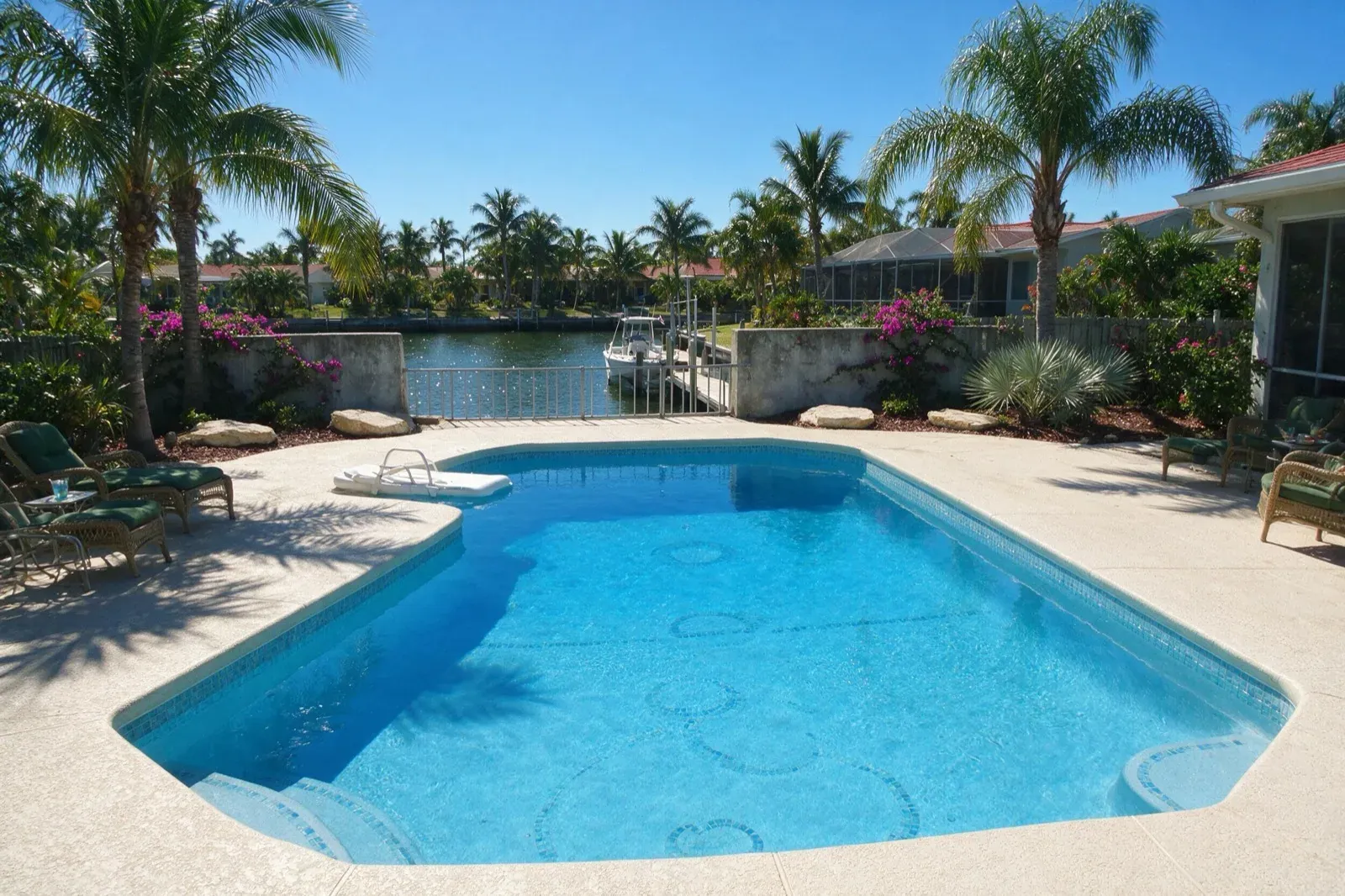 Clear, swim-ready canal-front Cape Coral pool after cleanup